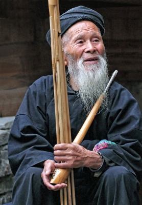 Chinese Lusheng Pipe Player